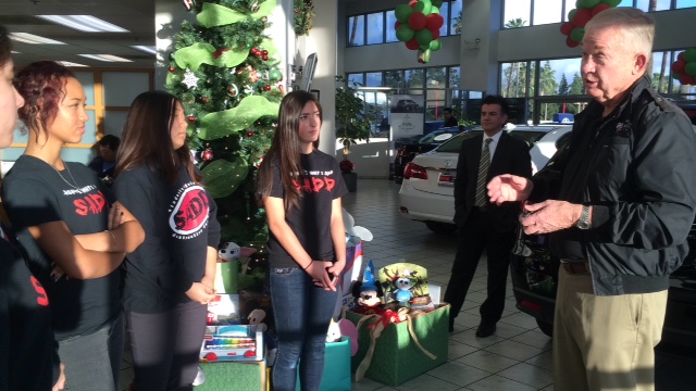 Girls are SADD volunteers who have collected app 200 toys