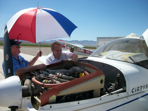 Cessna mechanic working on engine